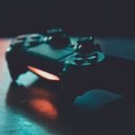 Person playing video games on a TV