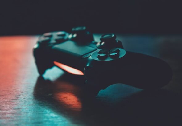 Person playing video games on a TV