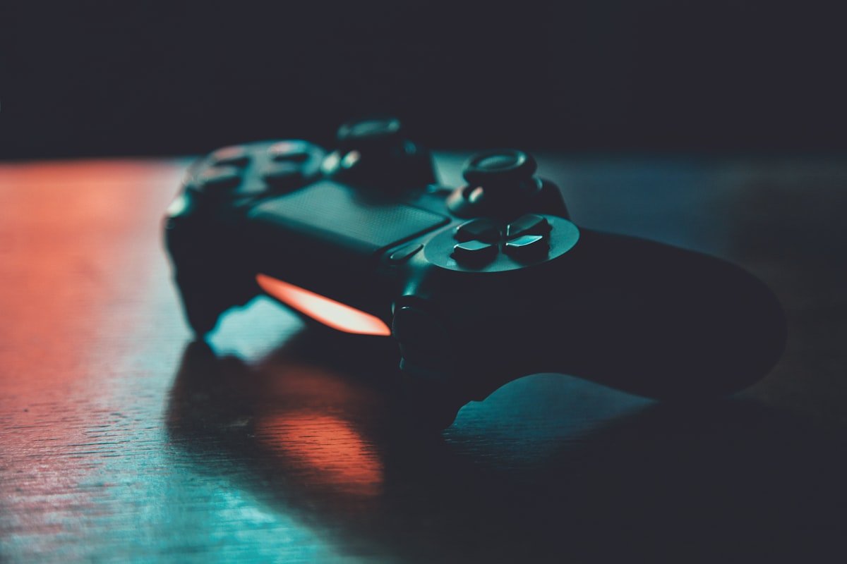 Person playing video games on a TV