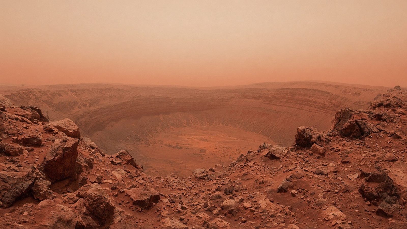 Rust-red rocky Martian terrain at the edge of an ancient crater