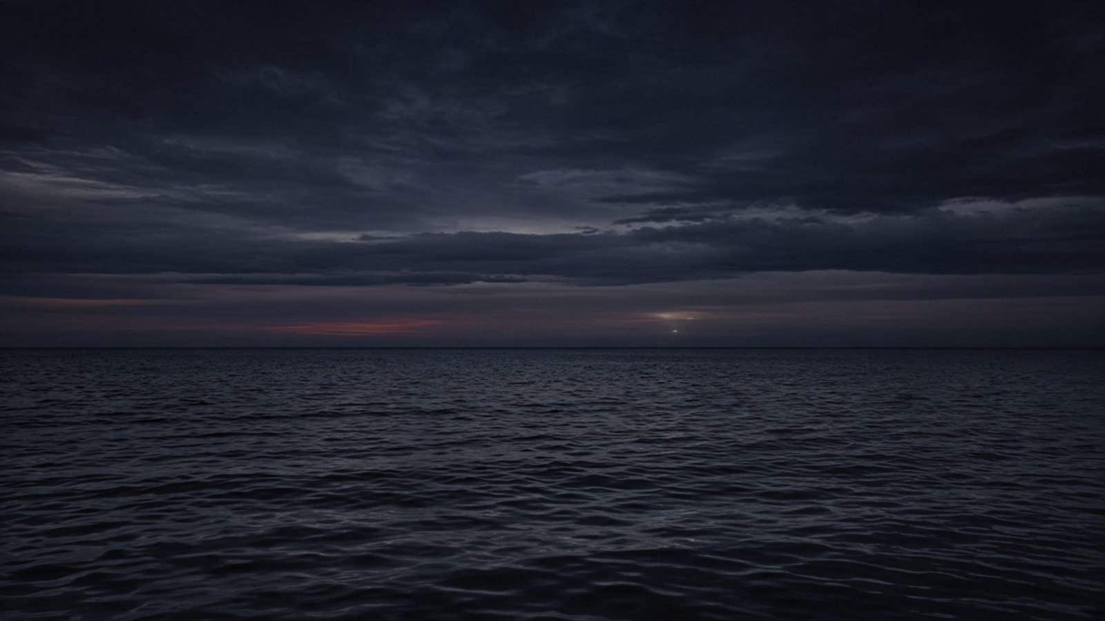 A wide dark East China Sea at dusk with a distant horizon